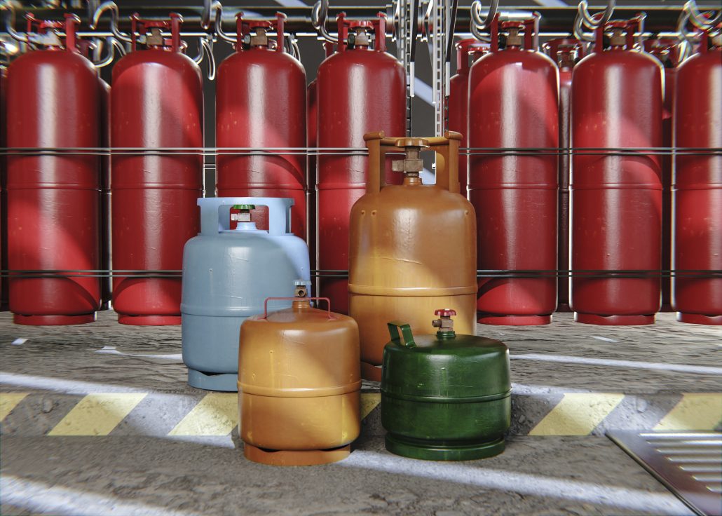 Propane gas cylinders of different sizes and colors stored in a warehouse with safety markings.