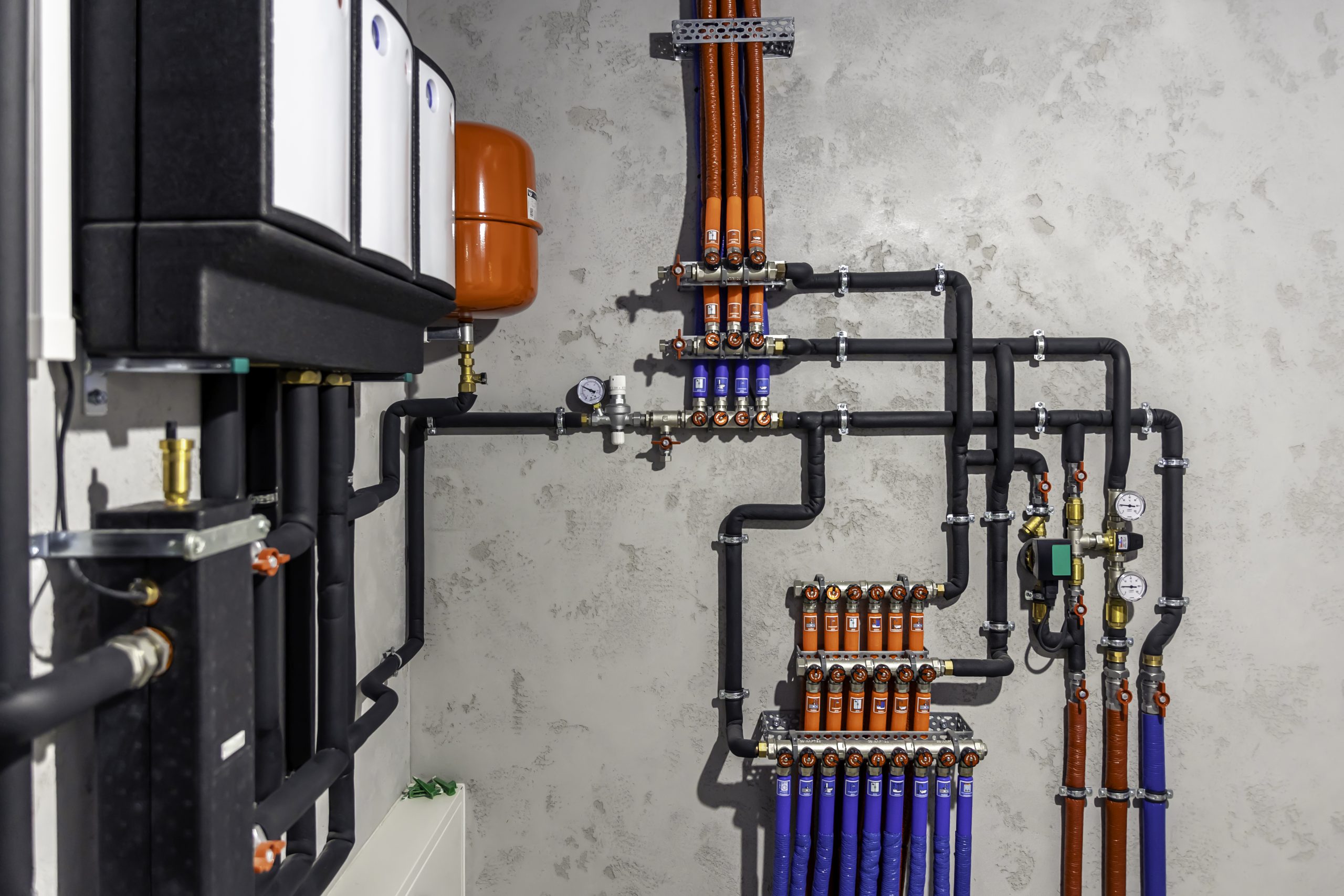 Modern home heating system with boiler and pipe manifold