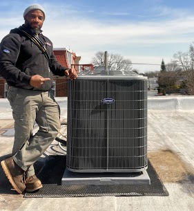 Boyle Energy Technician with an HVAC System.